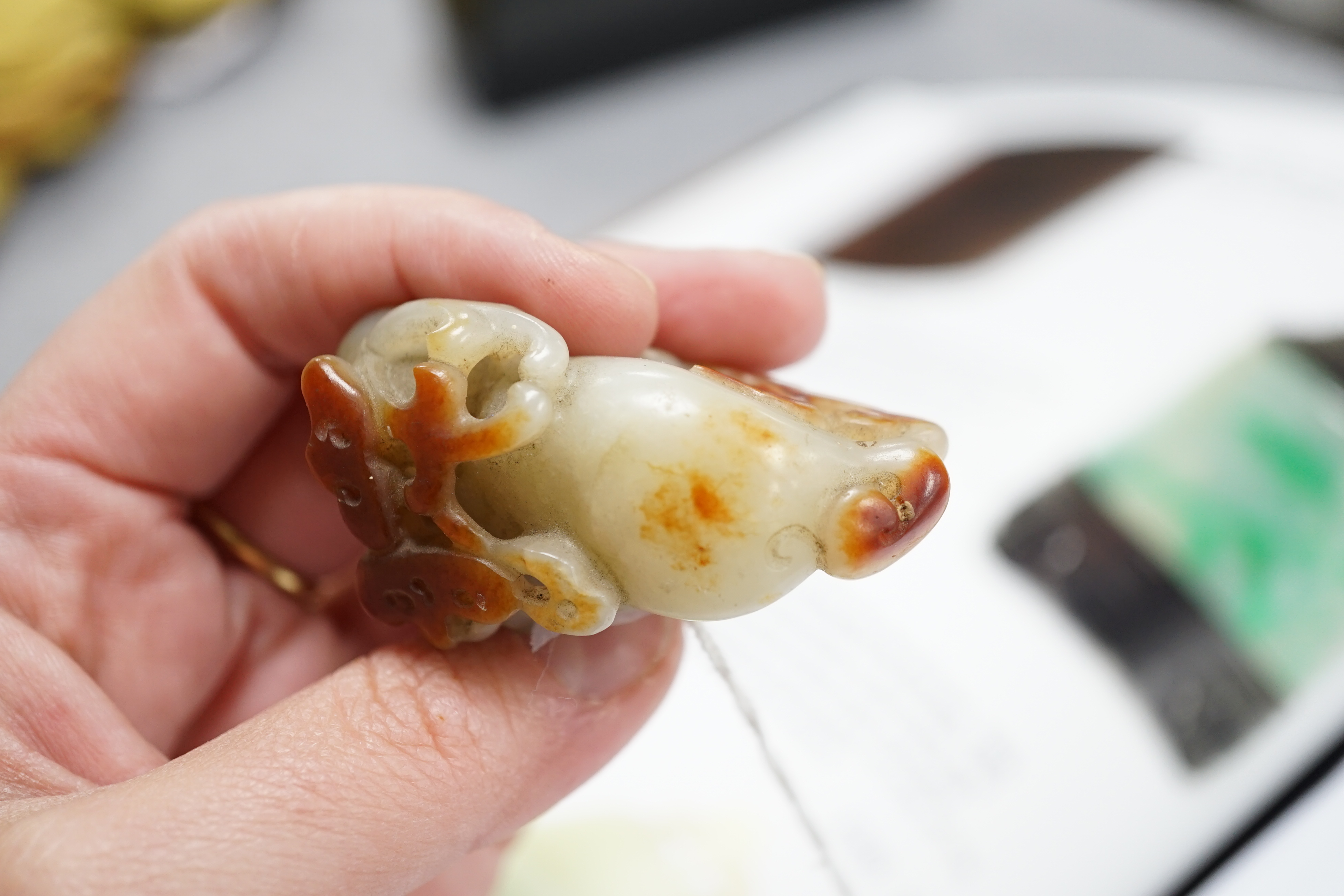 A Chinese pale celadon and russet skin jade figure of a stag, 19th century